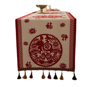 Chinese New Year table runner with red Fu character jacquard and colorful tassels