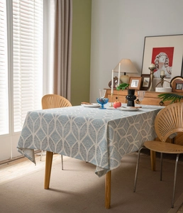 Detail of blue geometric leaf pattern on thick cotton linen tablecloth for home dining