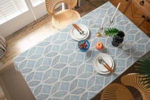 Detail of blue geometric leaf pattern on rectangular cotton linen table runner cloth