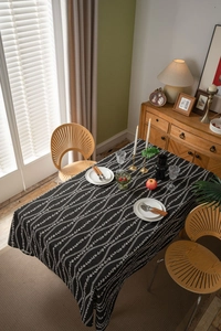 Macro detail of geometric floral pattern on premium cotton linen black tablecloth