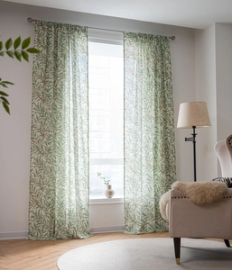 Detail view of semi-sheer green willow leaf print curtains with rod pocket design