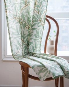 Detailed texture of green willow leaf print on semi-shading linen curtain fabric