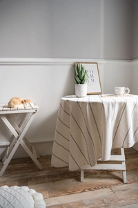 Detailed texture of striped linen cotton tablecloth with high-quality draping effect