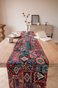 Close-up of bohemian geometric jacquard table runner with vintage fringe details