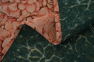 Close-up of thick jacquard fabric showing double-sided floral pattern and woven texture
