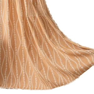 Brown cafe curtain with white wave print and tassel fringe trim on white background