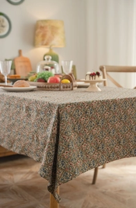 Detail of floral jacquard tablecloth with thick chenille texture and vintage drapes