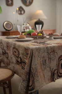 Detail of thick jacquard tablecloth featuring abstract modern patterns and woven texture