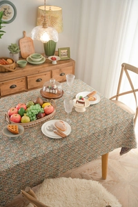 Close-up of thick floral jacquard tablecloth with intricate red and blue botanical patterns