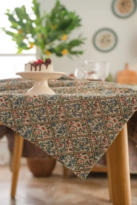 Detail of American retro floral jacquard tablecloth with textured diamond weave pattern