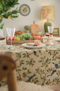Macro detail of thick American jacquard tablecloth with birds and floral botanical pattern