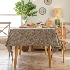 Floral rectangle tablecloth with vintage jacquard texture on a wooden dining table