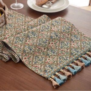 Nordic jacquard table runner with geometric floral patterns and colorful tassels
