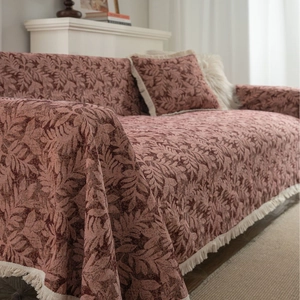Retro thick sofa cover with leaf jacquard pattern and white fringe in warm brown tones