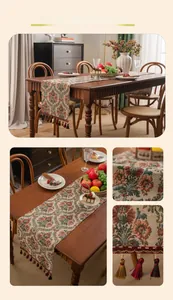 Detail of vintage floral jacquard table runner with colorful fringe tassels on wood table