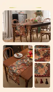Detail of vintage oil painting style table runner with floral jacquard and tassels