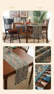 Detail of vintage floral jacquard table runner featuring delicate blue fringe tassels