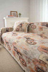 Détail de jeté de canapé jacquard avec cercles abstraits et bordures à franges beige