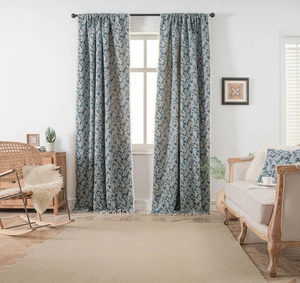 Blue floral leaf pattern curtain with elegant white tassel fringe details on metal rod