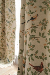 Close-up of vintage bird and floral jacquard fabric with detailed embroidery texture