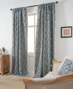 Detailed view of blue leaf jacquard curtains featuring elegant white tassel fringes on edges
