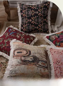 Detailed view of jacquard sofa cushion covers with tassels in vintage bohemian patterns