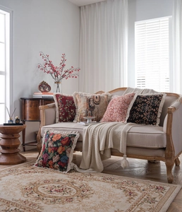 Detail showing vintage jacquard pillow covers with elegant white fringe tassel trim edges