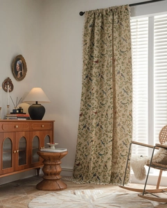 Detailed close-up of retro floral and bird pattern jacquard curtain with fringe edges