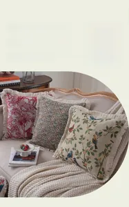 Detail of American jacquard decorative pillows with fringe edges and vintage floral patterns