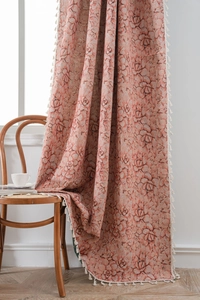 Detailed close-up of pink succulent floral jacquard fabric with white tassel edge trim