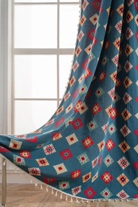 Detail of blue geometric jacquard curtains with ethnic diamond pattern and white tassels