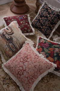 Detailed close-up of bohemian jacquard pillow covers with elegant white fringe edges