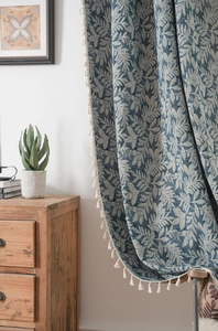 Detailed blue coconut leaf jacquard pattern on a cotton linen curtain with white tassels