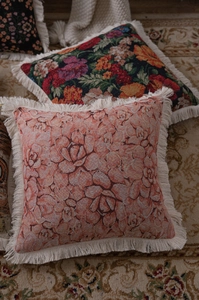Detail of vintage American jacquard woven pillowcase with elegant floral patterns and tassels