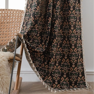 Elegant black floral jacquard curtain with fringe detail and vintage blossom patterns
