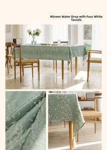 Close-up of green tablecloth with white droplet jacquard pattern and corner tassels