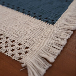 Navy blue woven table runner with cream lace crochet edges and fine fringe tassels