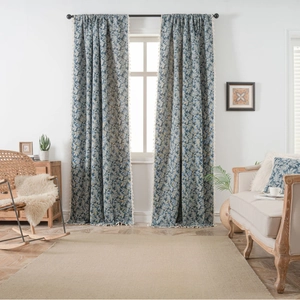 Blue botanical pattern curtains with white tassel trim and coconut leaf jacquard design