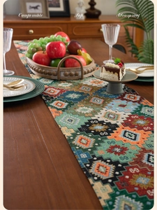 Close-up of bohemian woven table runner featuring colorful geometric rhombus jacquard patterns