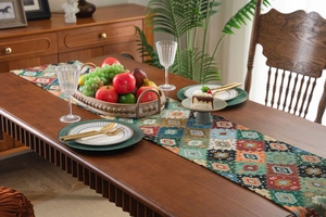 Detailed view of bohemian woven table runner with colorful geometric jacquard patterns