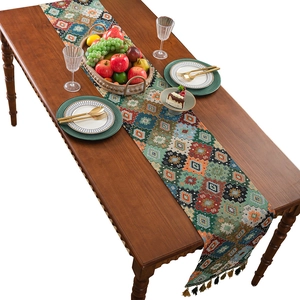 Bohemian table runner with colorful geometric jacquard patterns and elegant tassels