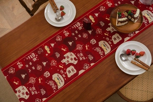Close-up of red festive table runner with traditional Chinese floral jacquard patterns