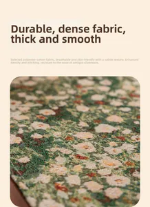 Close-up of thick green jacquard floral fabric with high-density weave texture