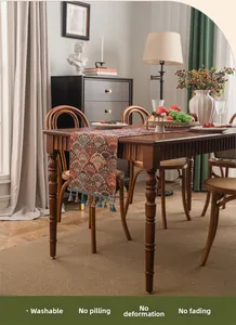 Close-up of jacquard ginkgo leaf table runner with elegant tassels and durable fabric