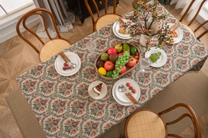 Detailed macro texture of vintage floral jacquard tablecloth with rustic tassels