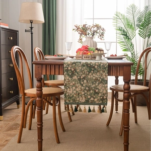 Floral jacquard table runner in deep green with tassels for rustic home dining decor