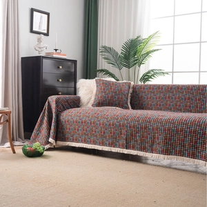 Copridivano jacquard retrò con motivo a scacchi colorati e frange in bianco sporco