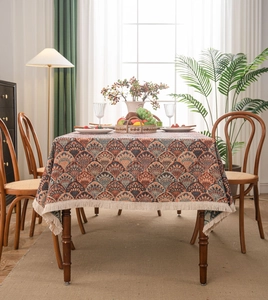 Detailed close-up of bohemian jacquard tablecloth with geometric patterns and fringe