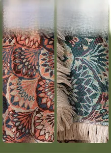 Detail of bohemian sofa cover showing double-sided jacquard weave and cream fringe