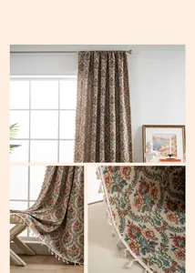 Close-up detail of vintage floral jacquard fabric with elegant cream tassel fringe edging